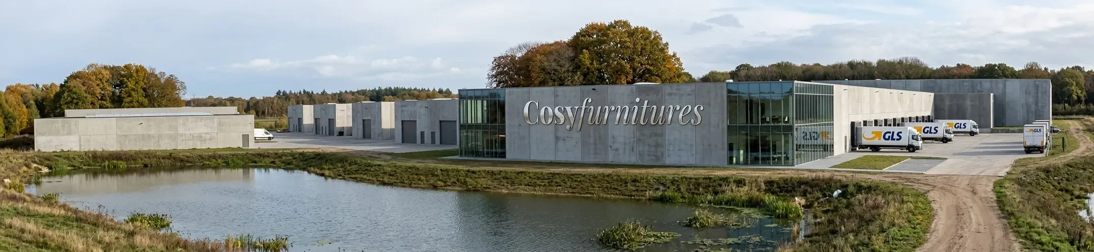 Modern furniture warehouse and headquarters with delivery trucks, large-scale logistics centre for premium furniture distribution